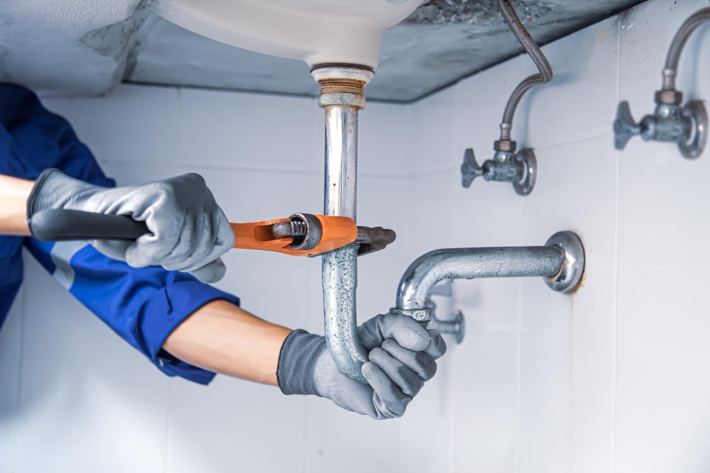 Master plumber repairing faucet in Pickering